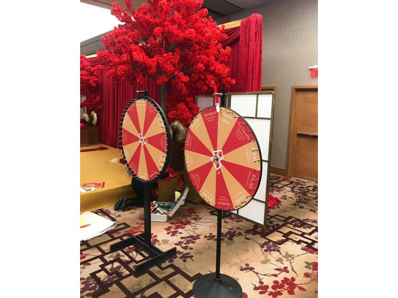 Two customized Promo wheel rentals ready for an event.
