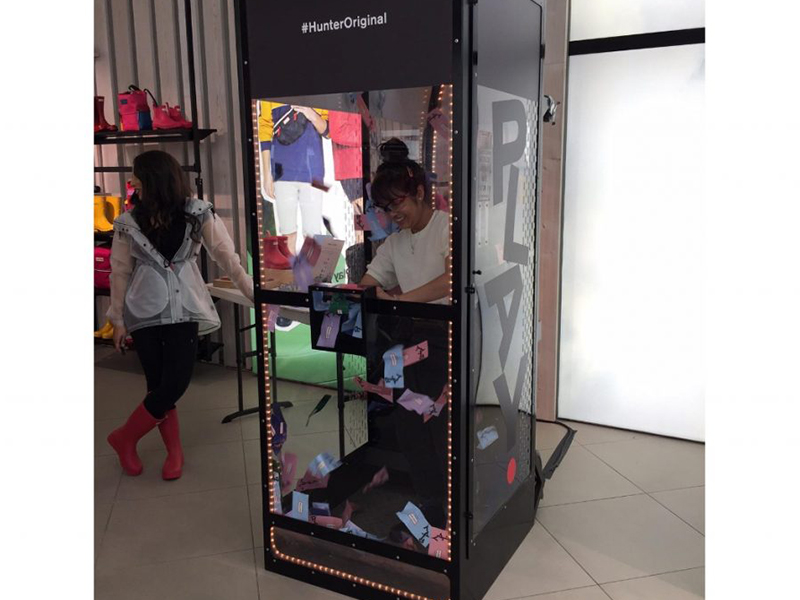 Woman using the Premium Money Machine.