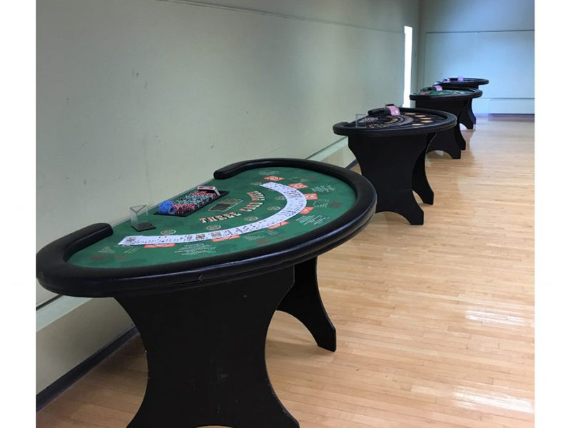 Three card poker tables lined up.