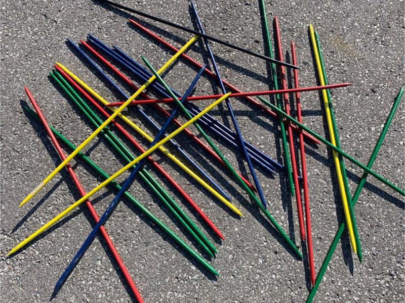Giant Pick Up sticks at an outdoor event.