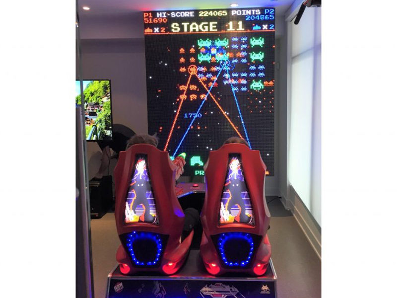 Space Invaders Frenzy Arcade being played by two kids.