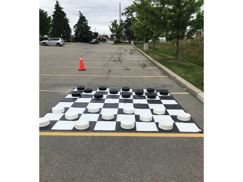 Giant Checkers rental at an outdoor event.
