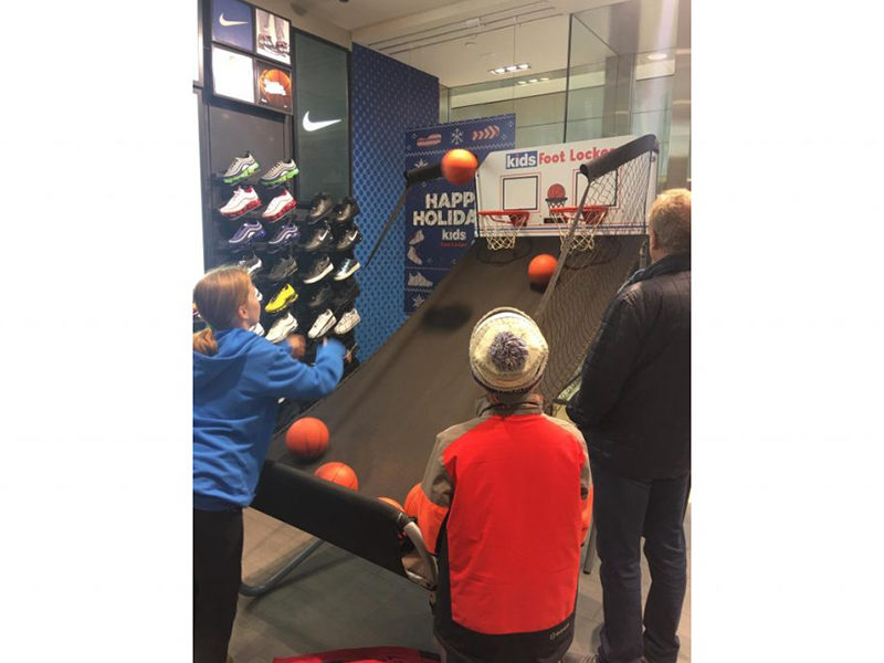 Kids playing Electronic Basketball.