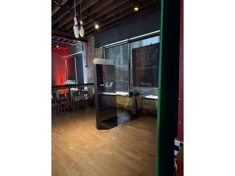 Sleek full-length Mirror Photo Booth setup with red carpet and velvet ropes at an upscale event