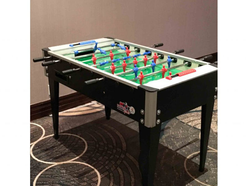 Foosball table set up and ready to play.
