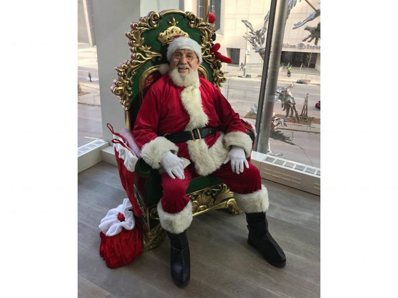 Santa Claus sitting on the Santa Throne rental.