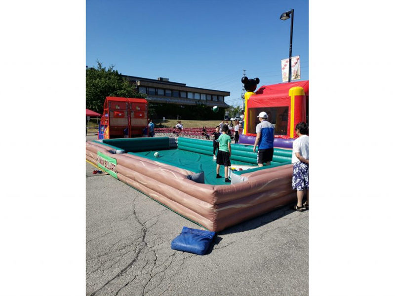 People enjoying the Inflatable Giant Billiards.