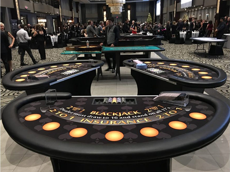 Three Blackjack table rentals ready for casino party.