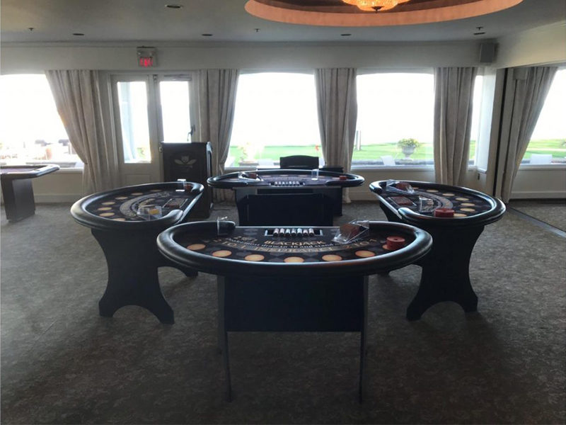 Four Blackjack Table rentals set up for an event.