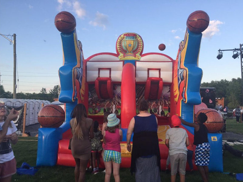 People playing the Shooting Stars Basketball Inflatable rental.