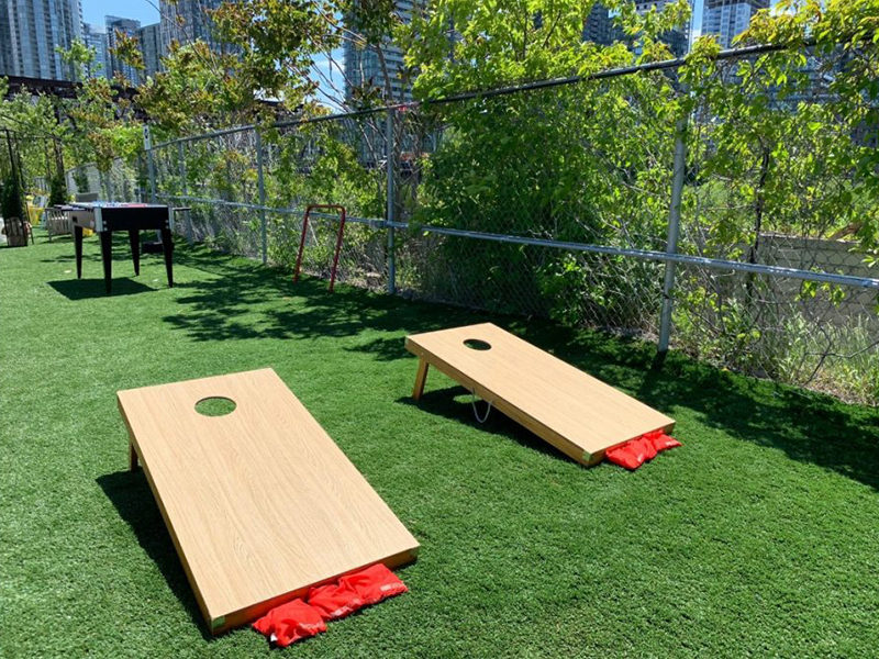 Cornhole set up for outdoor event in Toronto.