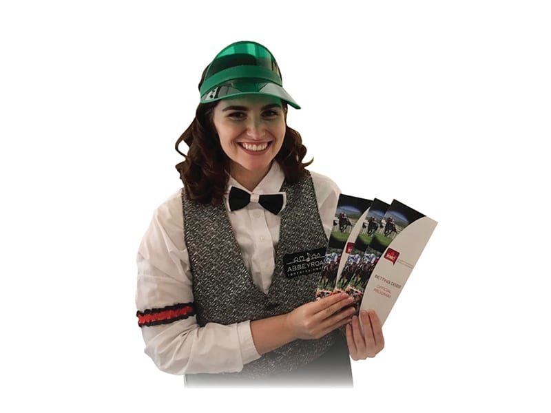 Woman holding Horse racing pamphlets for A Night At The Races in Toronto.