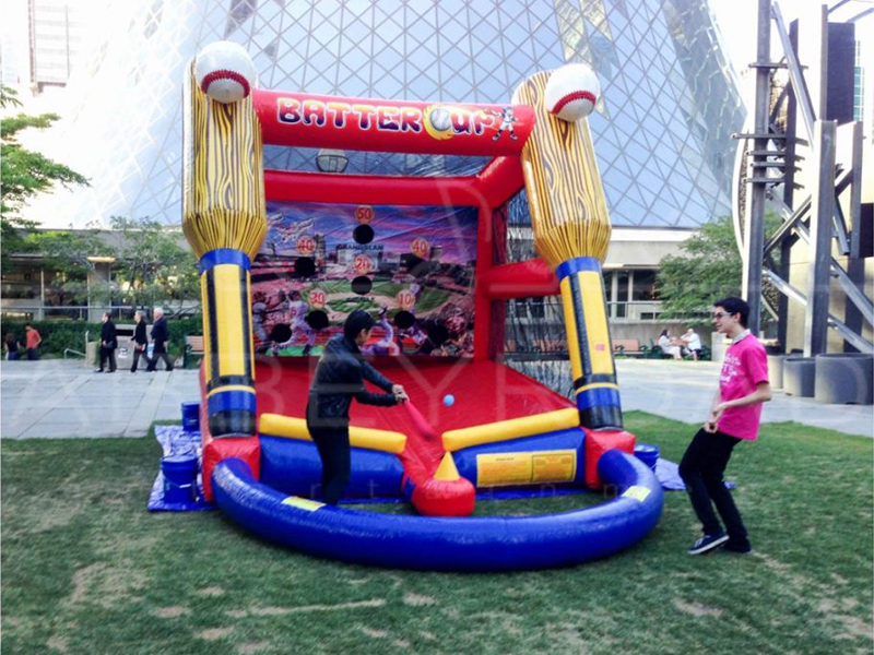 Man playing the Batter Up Baseball Inflatable.