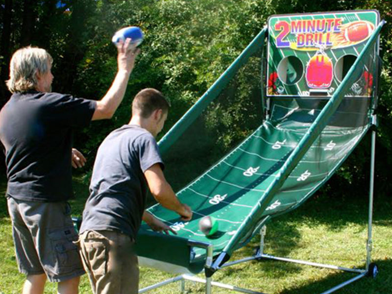 People playing Electronic Football at outdoor event.