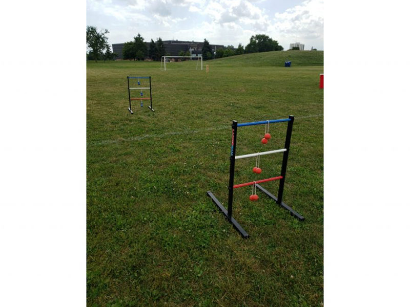 Ladder Ball rental set up at outdoor event in field.