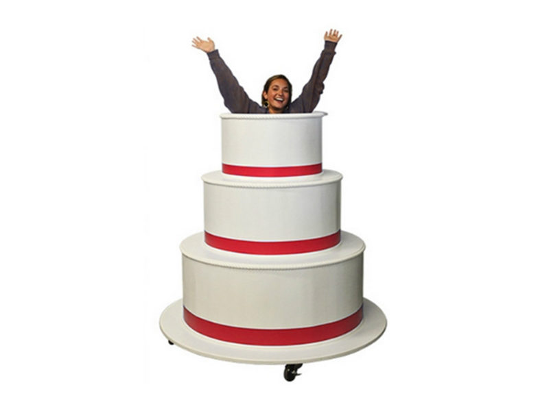 Giant Pop-Out Cake rental in Toronto with woman inside.