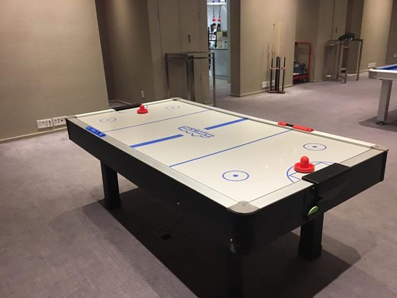 Air Hockey Table Set up at a party, side image.