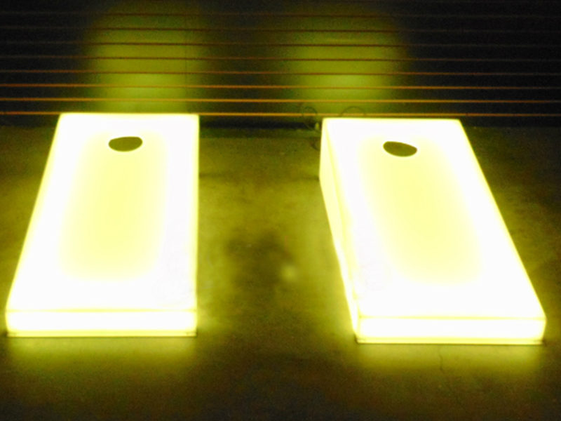 Pair of yellow LED Cornholes.