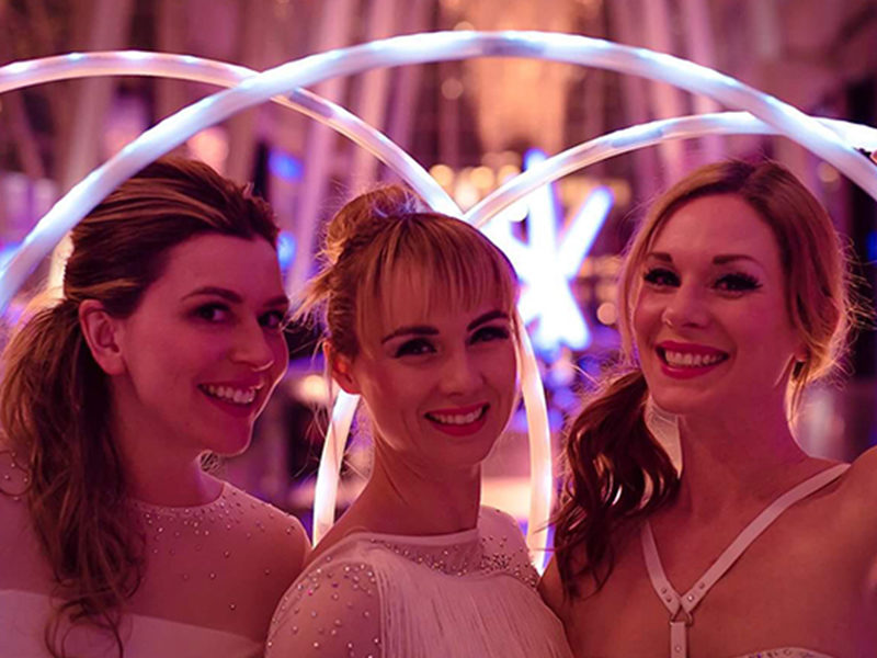 Three LED Hula Hoop Performers ready for show.
