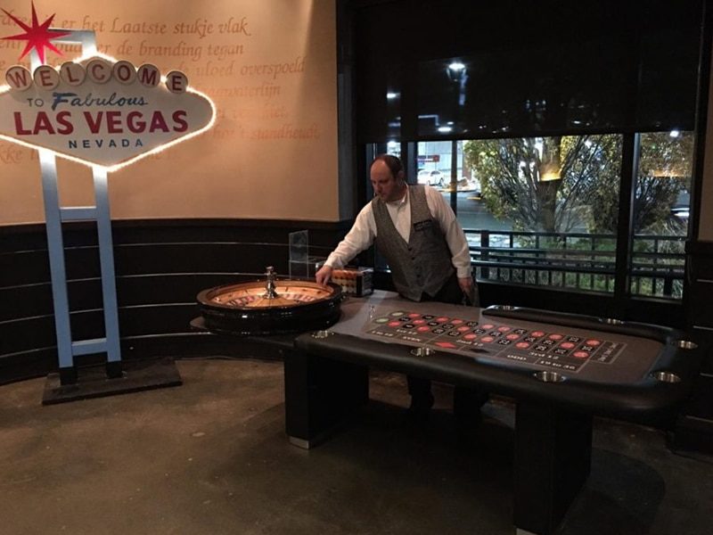 Las Vegas Sign rental next to an Authentic Roulette Table rental.