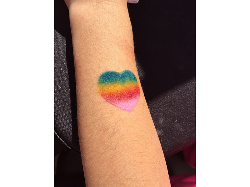 Air Brush Tattoo of a rainbow heart at event in Toronto.