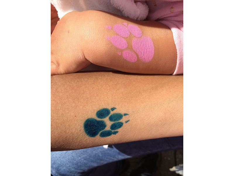 Air Brush Tattoos of a paw print at event in Toronto.