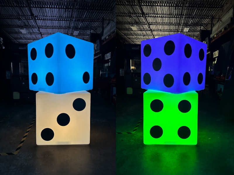 Colorful giant LED dice on a gaming table, available for rental in Toronto events