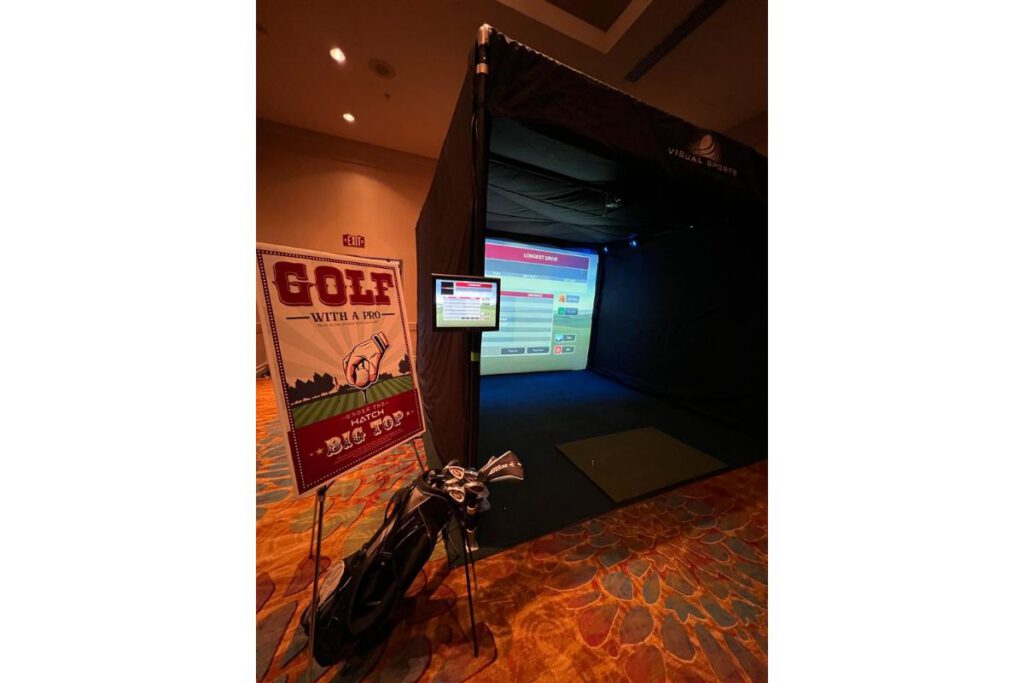 Employee using a golf simulator at work