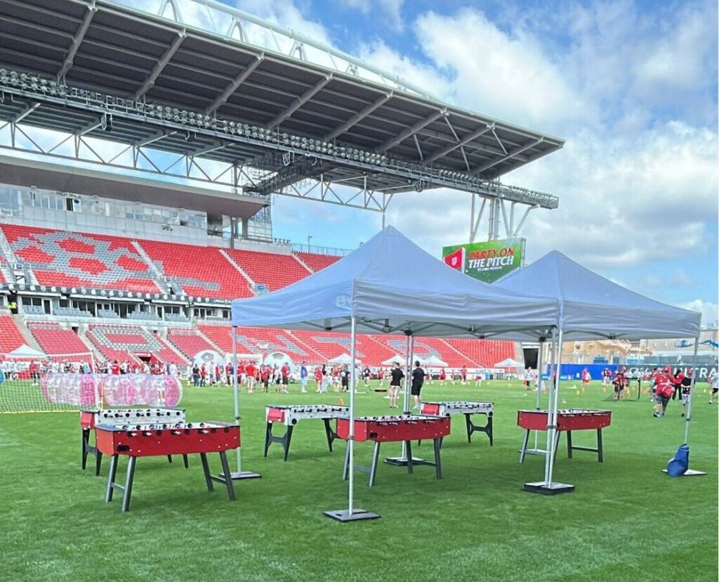 Outdoor entertainment rentals set up for a corporate picnic