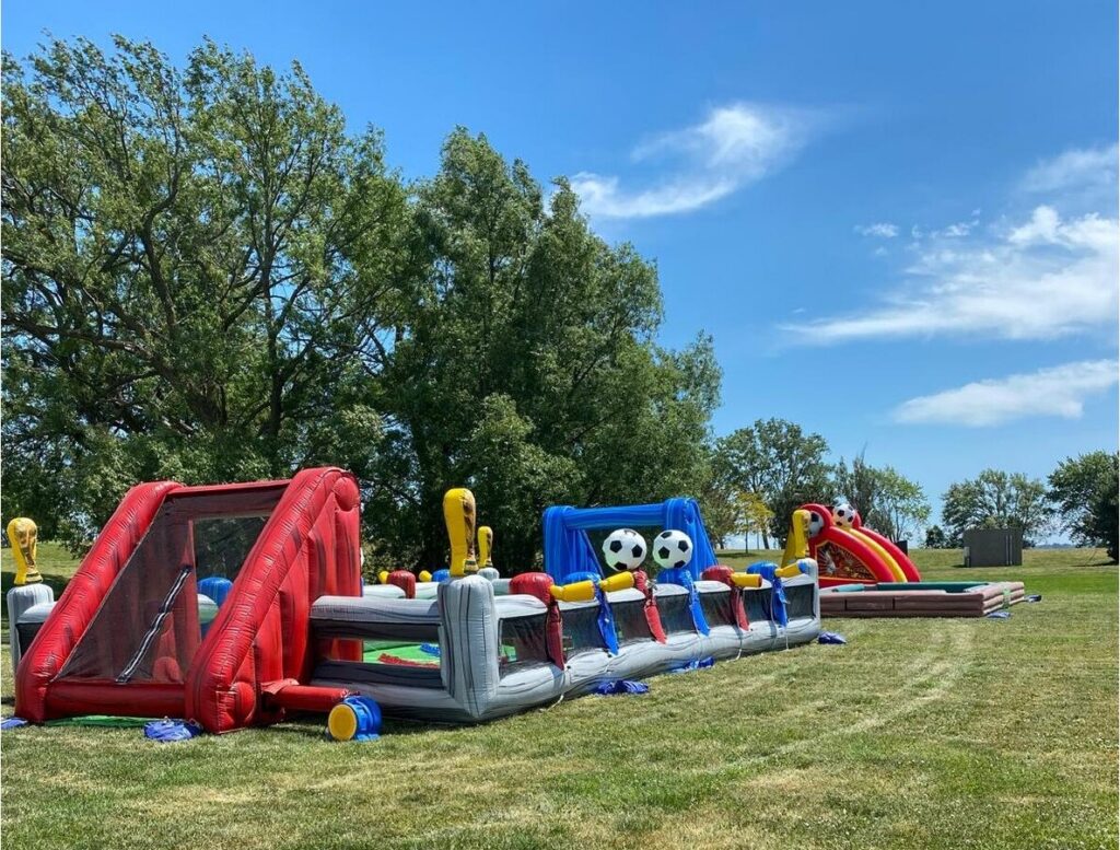 Guests playing giant lawn games at a company family day