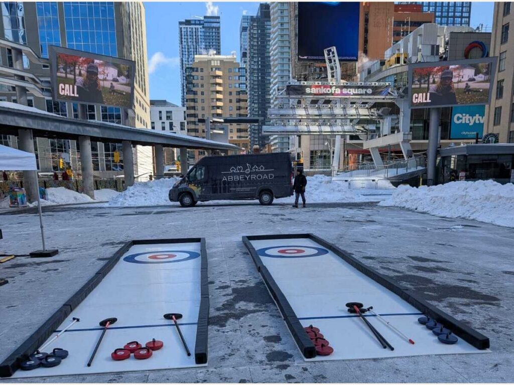 Employees enjoying interactive entertainment at a Toronto corporate event