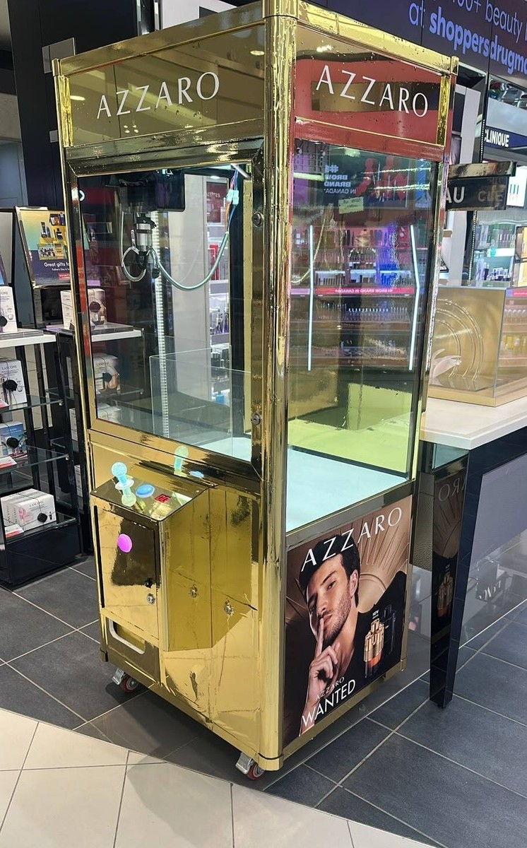 Gold-wrapped claw machine for Azzaro