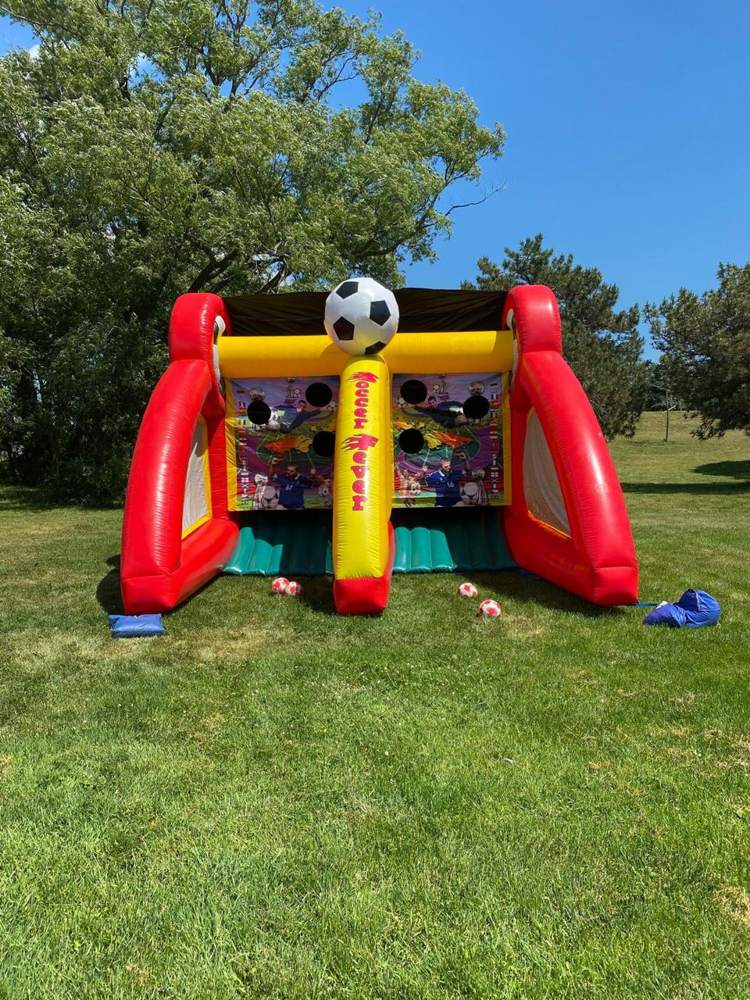 Soccer shootout inflatable game set up in a sunny park