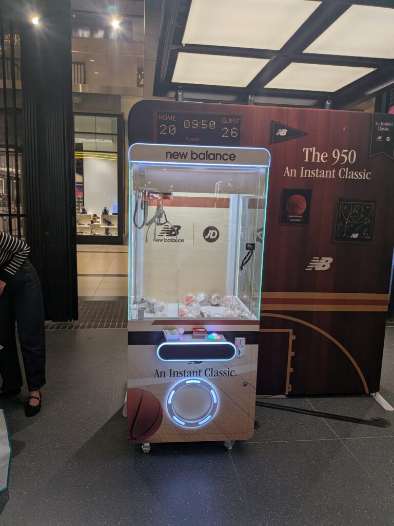 Branded claw machine filled with prizes